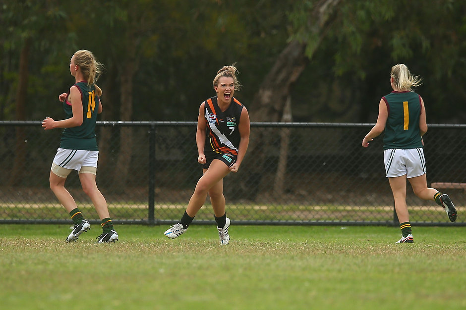 AFL 2016 Media - Womens Match Northern Territory v Tasmania MELBOURNE, AUSTRALIA - APRIL 10: Abbey Holmes of Northern Territory (C) celebrates kicking a goal during the Women's Exhibition match between Northern Territory and Tasmania at Peanut Farm Reserve on April 10, 2016 in Melbourne, Australia. (Photo by Graham Denholm/AFL Media/)